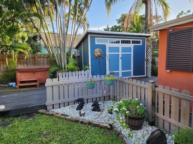 832 N D St, Lake Worth Beach, FL 33460 - view of shed with a hot tub and a fenced backyard