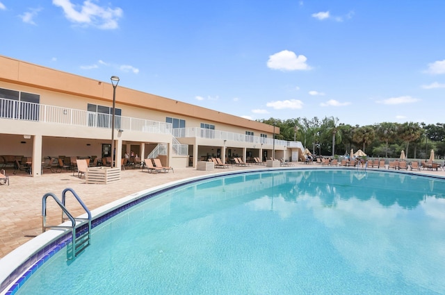 15365 Lakes Of Delray Blvd Unit 106, Delray Beach, FL 33484 - community pool featuring a patio area and stairway