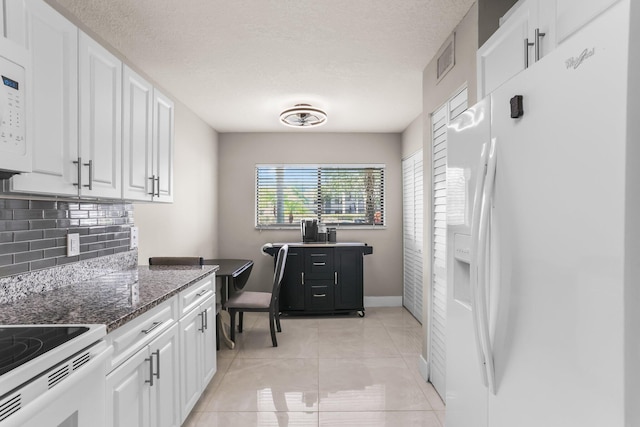 15365 Lakes Of Delray Blvd Unit 106, Delray Beach, FL 33484 - kitchen with white appliances, white cabinetry, dark stone countertops, tasteful backsplash, and a textured ceiling