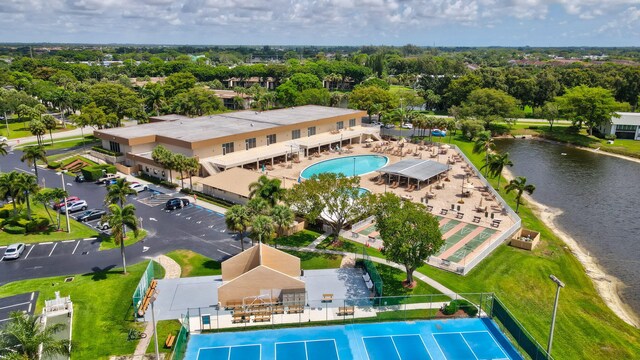 15365 Lakes Of Delray Blvd Unit 106, Delray Beach, FL 33484 - bird's eye view of a pool, a nearby body of water, and a tree filled landscape