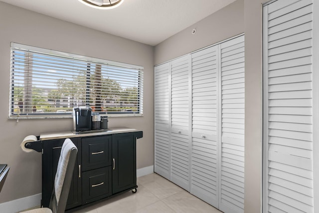 15365 Lakes Of Delray Blvd Unit 106, Delray Beach, FL 33484 - office featuring baseboards and light tile patterned flooring