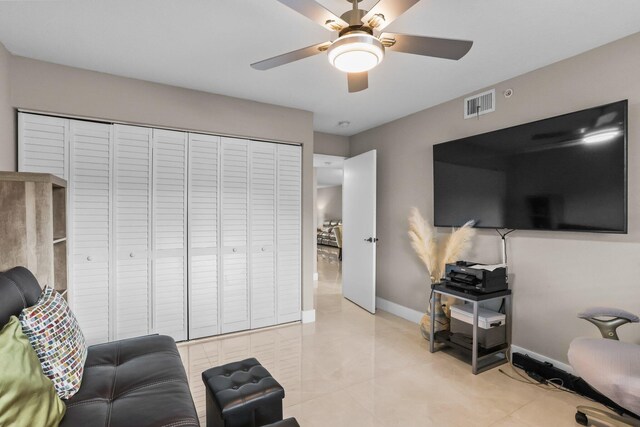 15365 Lakes Of Delray Blvd Unit 106, Delray Beach, FL 33484 - living area with ceiling fan and baseboards