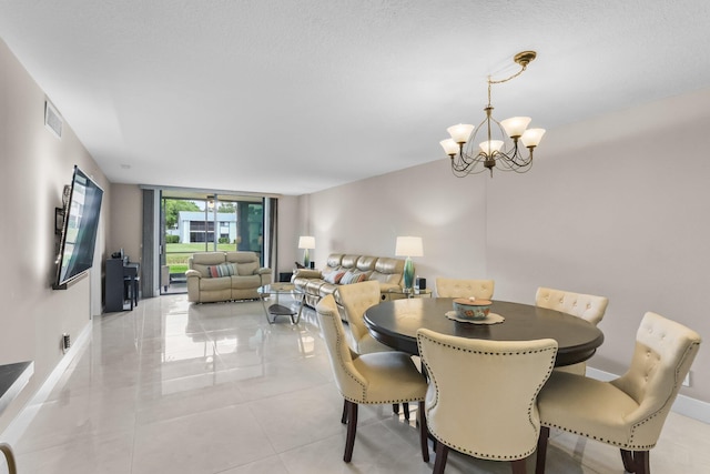15365 Lakes Of Delray Blvd Unit 106, Delray Beach, FL 33484 - dining space featuring a chandelier and baseboards