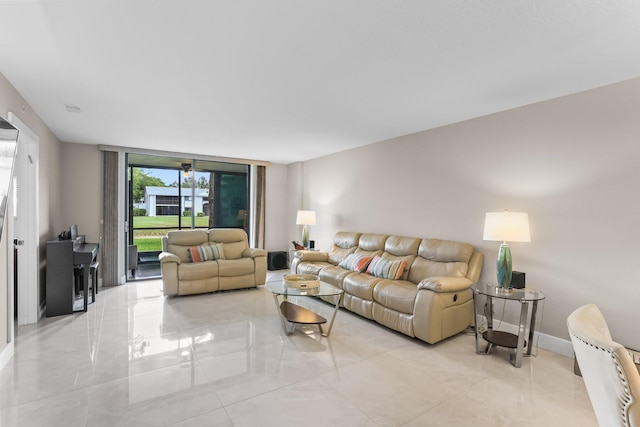 15365 Lakes Of Delray Blvd Unit 106, Delray Beach, FL 33484 - living area featuring floor to ceiling windows, light tile patterned floors, and baseboards