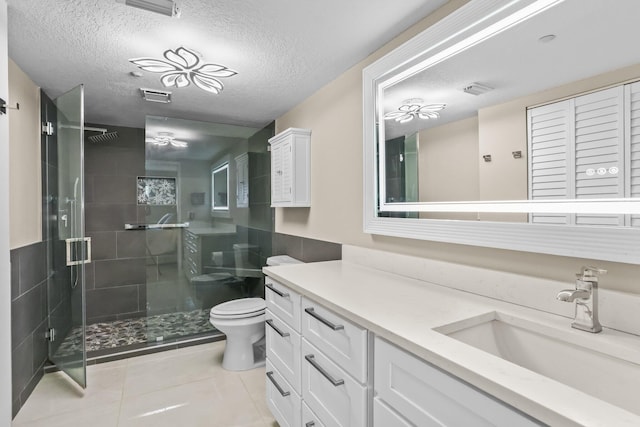 15365 Lakes Of Delray Blvd Unit 106, Delray Beach, FL 33484 - full bath featuring toilet, a stall shower, vanity, tile patterned floors, and a textured ceiling