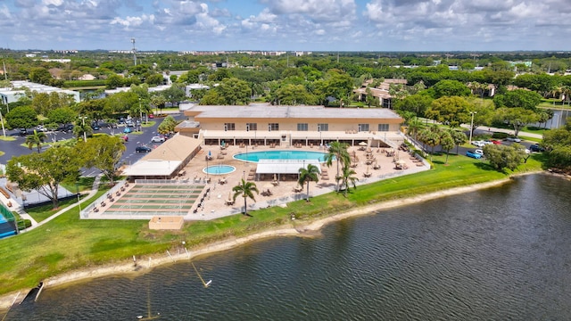 15365 Lakes Of Delray Blvd Unit 106, Delray Beach, FL 33484 - drone / aerial view of a pool area, a large body of water, and a tree filled landscape