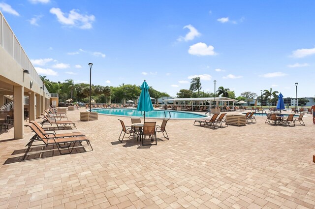 15365 Lakes Of Delray Blvd Unit 106, Delray Beach, FL 33484 - community pool featuring a patio
