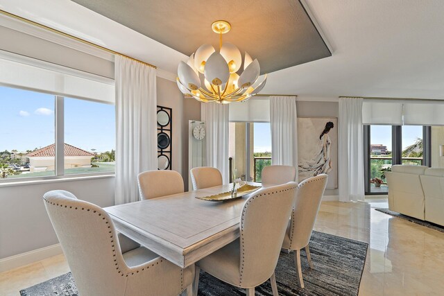 3610 Gardens Pkwy Unit 403A, Palm Beach Gardens, FL 33410 - dining room with a chandelier, plenty of natural light, and baseboards