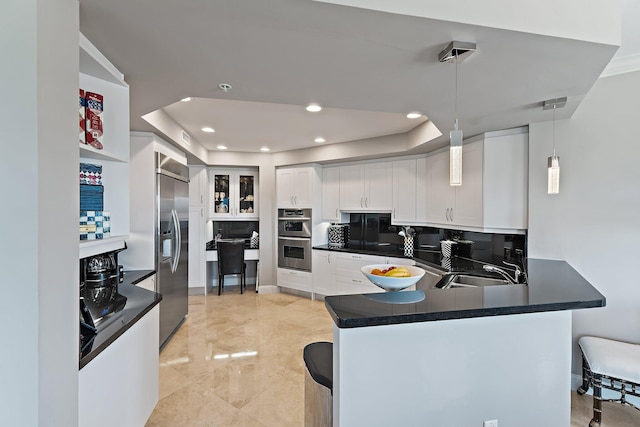 3610 Gardens Pkwy Unit 403A, Palm Beach Gardens, FL 33410 - kitchen featuring appliances with stainless steel finishes, a sink, dark countertops, and recessed lighting