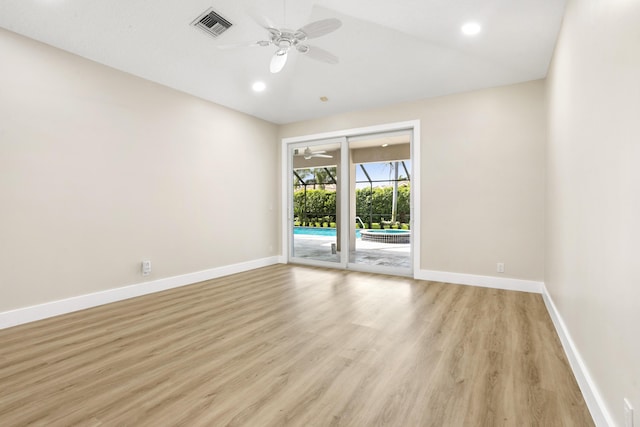 3333 Southern Cay Dr, Jupiter, FL 33477 - empty room featuring ceiling fan, baseboards, light wood-style floors, vaulted ceiling, and recessed lighting