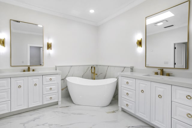 3333 Southern Cay Dr, Jupiter, FL 33477 - full bath with marble finish flooring, a wainscoted wall, crown molding, two vanities, and a freestanding bath