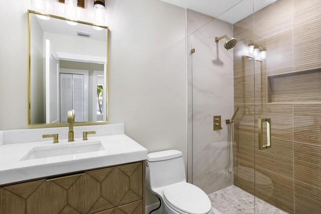 3333 Southern Cay Dr, Jupiter, FL 33477 - bathroom with a stall shower, toilet, and vanity