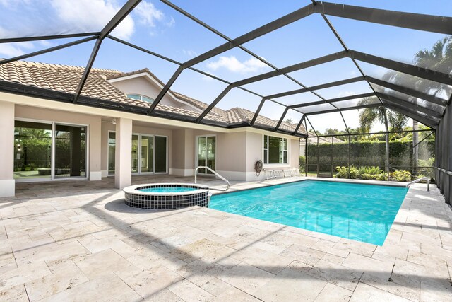 3333 Southern Cay Dr, Jupiter, FL 33477 - view of pool featuring a patio, a pool with connected hot tub, and glass enclosure