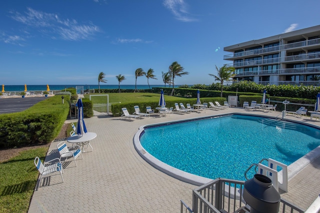 3230 S Ocean Blvd Unit D511, Palm Beach, FL 33480 - community pool featuring a patio area, fence, and a water view