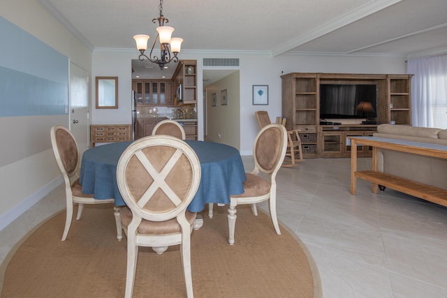 3230 S Ocean Blvd Unit D511, Palm Beach, FL 33480 - dining area with a chandelier, crown molding, baseboards, and light tile patterned flooring