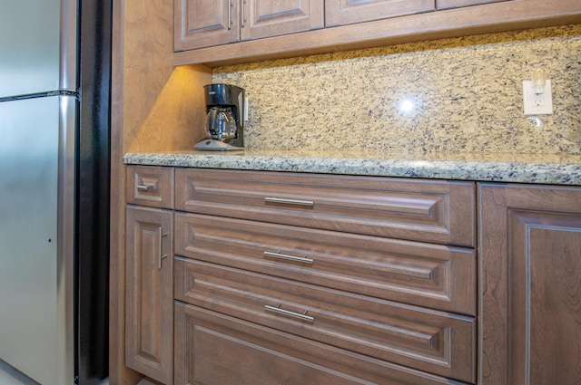 3230 S Ocean Blvd Unit D511, Palm Beach, FL 33480 - kitchen view of freestanding refrigerator, tasteful backsplash, and light stone countertops