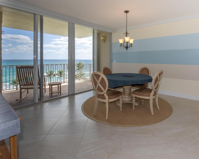 3230 S Ocean Blvd Unit D511, Palm Beach, FL 33480 - dining room with a chandelier, crown molding, a water view, floor to ceiling windows, and tile patterned floors