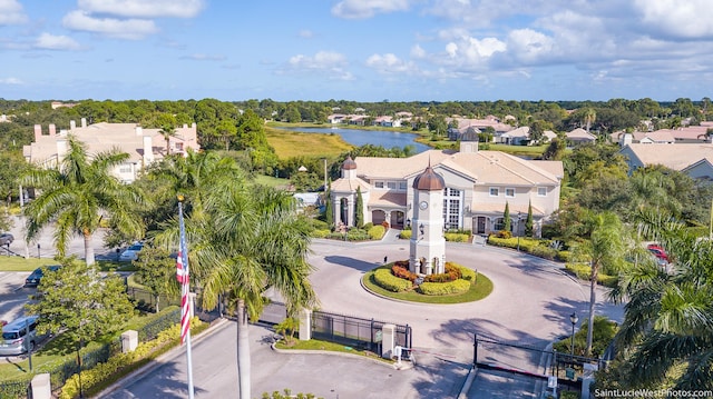 166 SW Peacock Blvd Unit 34-205, Port Saint Lucie, FL 34986 - aerial view of residential area with a large body of water and a tree filled landscape