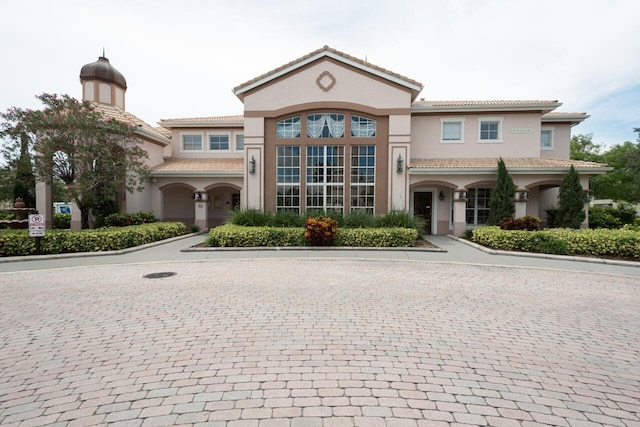 166 SW Peacock Blvd Unit 34-205, Port Saint Lucie, FL 34986 - view of front of home with stucco siding and a tiled roof