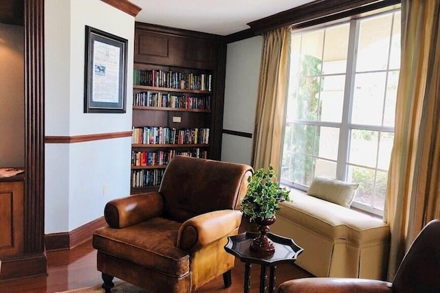 166 SW Peacock Blvd Unit 34-205, Port Saint Lucie, FL 34986 - sitting room featuring wood finished floors, built in features, and baseboards