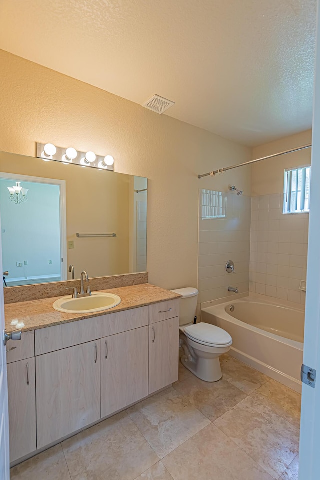 166 SW Peacock Blvd Unit 34-205, Port Saint Lucie, FL 34986 - bathroom featuring vanity, shower / tub combination, toilet, a textured wall, and a textured ceiling