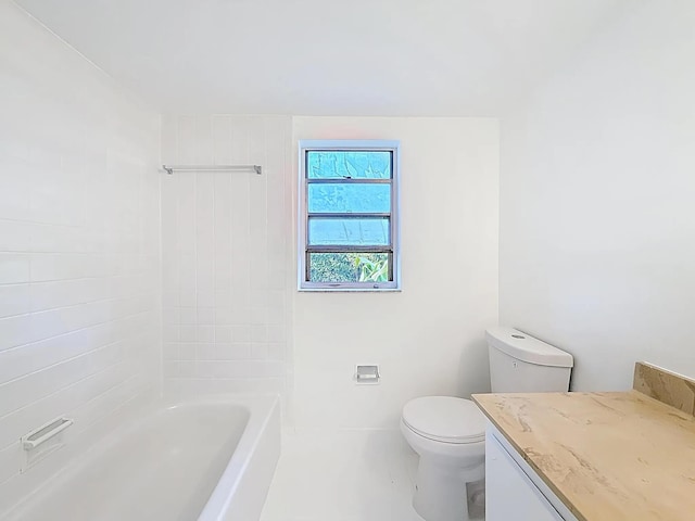 bathroom featuring toilet, vanity, and tile patterned flooring