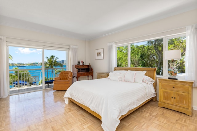 250 Bradley Pl Unit 408, Palm Beach, FL 33480 - bedroom featuring access to exterior, multiple windows, ornamental molding, and a water view