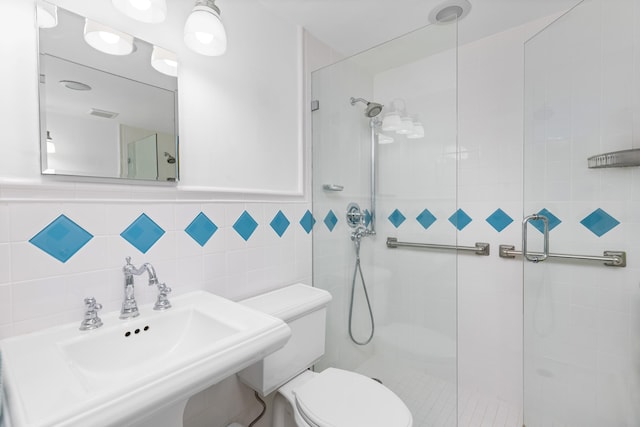 250 Bradley Pl Unit 408, Palm Beach, FL 33480 - bathroom with a sink, a stall shower, toilet, and tile walls