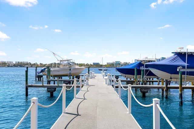 250 Bradley Pl Unit 408, Palm Beach, FL 33480 - dock area with boat lift and a water view