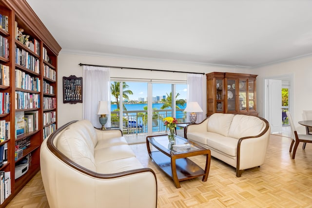 250 Bradley Pl Unit 408, Palm Beach, FL 33480 - living area with ornamental molding and a water view