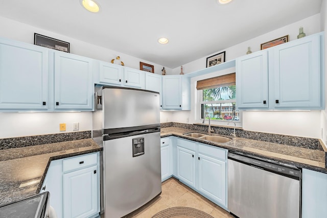 711 NE Harbour Ter Unit 4120, Boca Raton, FL 33431 - kitchen featuring appliances with stainless steel finishes, light tile patterned floors, recessed lighting, dark stone countertops, and blue cabinets