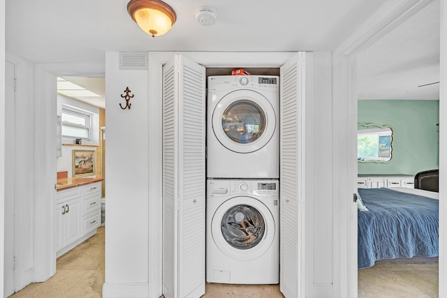 711 NE Harbour Ter Unit 4120, Boca Raton, FL 33431 - laundry area with stacked washer / dryer