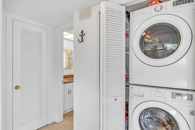 711 NE Harbour Ter Unit 4120, Boca Raton, FL 33431 - laundry room featuring stacked washing machine and dryer