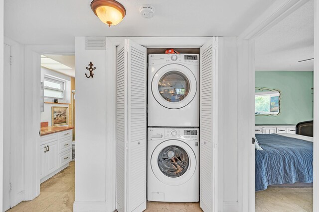 711 NE Harbour Ter Unit 4120, Boca Raton, FL 33431 - washroom with stacked washer and clothes dryer