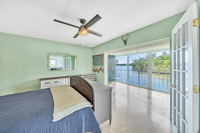 711 NE Harbour Ter Unit 4120, Boca Raton, FL 33431 - tiled bedroom with access to outside, a water view, and a ceiling fan