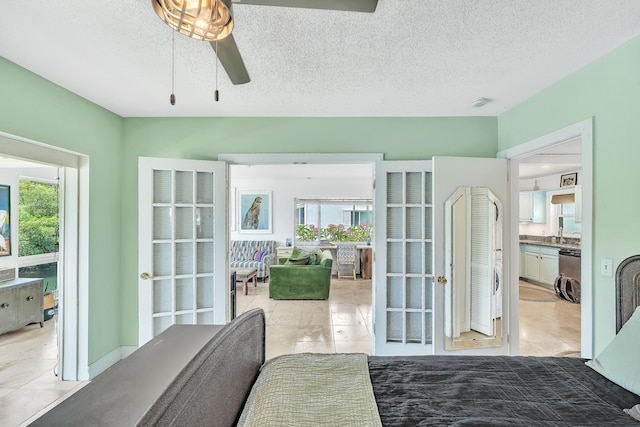 711 NE Harbour Ter Unit 4120, Boca Raton, FL 33431 - bedroom with a textured ceiling, light tile patterned floors, and a ceiling fan