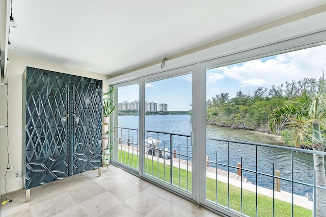 711 NE Harbour Ter Unit 4120, Boca Raton, FL 33431 - unfurnished sunroom featuring a water view
