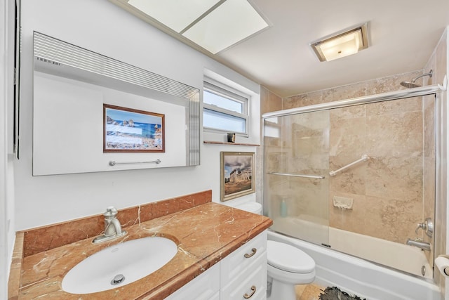 711 NE Harbour Ter Unit 4120, Boca Raton, FL 33431 - bathroom featuring vanity, toilet, and bath / shower combo with glass door