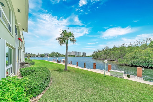 711 NE Harbour Ter Unit 4120, Boca Raton, FL 33431 - view of grassy yard featuring a water view and a dock