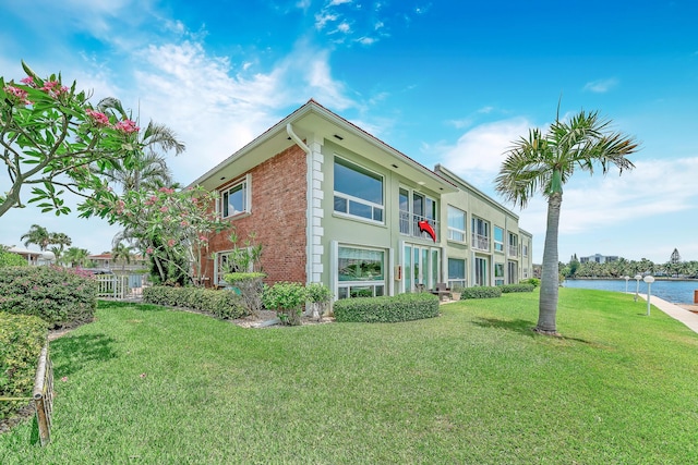 711 NE Harbour Ter Unit 4120, Boca Raton, FL 33431 - view of building exterior with a water view