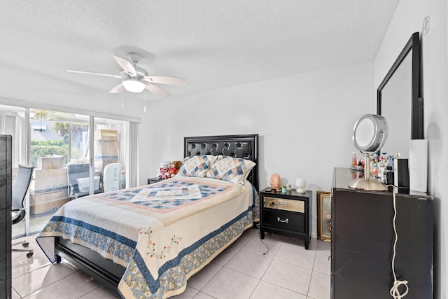 2538 Boundbrook Dr S Unit 140, West Palm Beach, FL 33406 - bedroom featuring light tile patterned floors, a textured ceiling, and ceiling fan