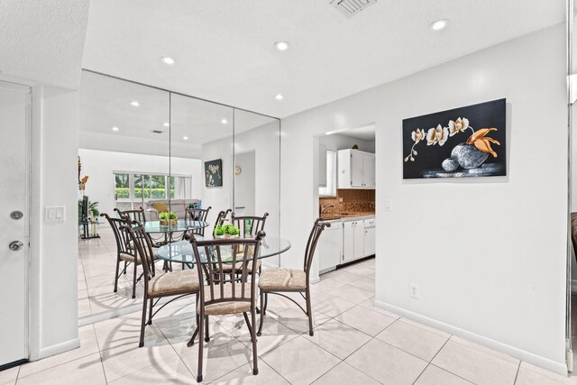 2538 Boundbrook Dr S Unit 140, West Palm Beach, FL 33406 - dining space featuring light tile patterned floors, recessed lighting, and baseboards