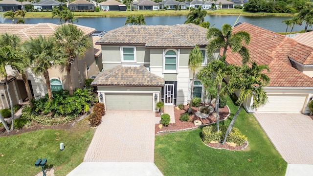 7897 Monarch Ct, Delray Beach, FL 33446 - view of front of house with a residential view, decorative driveway, and stucco siding