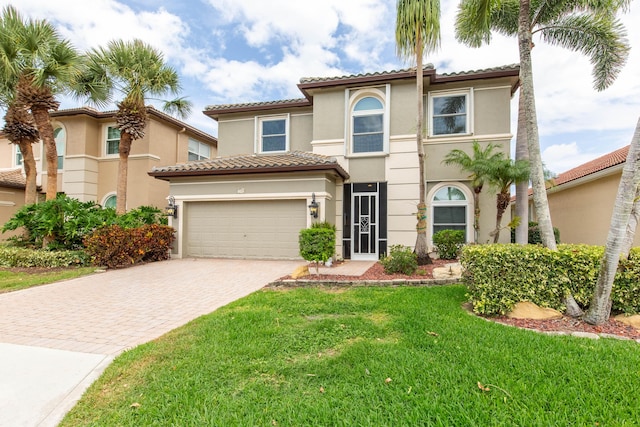 7897 Monarch Ct, Delray Beach, FL 33446 - view of front of property featuring driveway, stucco siding, an attached garage, a tile roof, and a front lawn