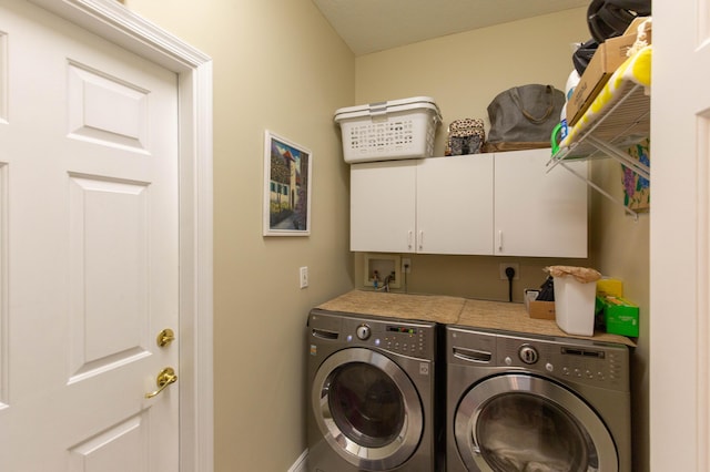 7897 Monarch Ct, Delray Beach, FL 33446 - washroom with washing machine and clothes dryer, cabinet space, and baseboards