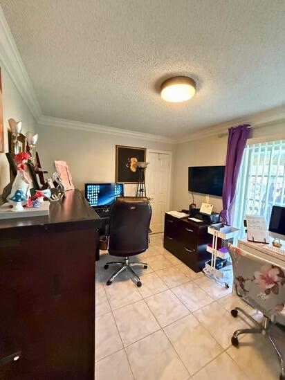 3790 Silver Lace Ln, Boynton Beach, FL 33436 - office space featuring crown molding, light tile patterned flooring, and a textured ceiling