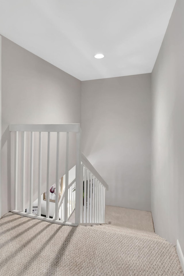 stairs featuring carpet flooring and recessed lighting