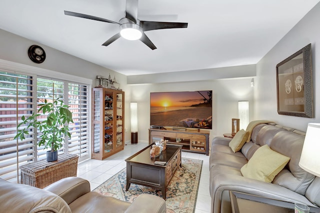 living room featuring a ceiling fan and light tile patterned flooring