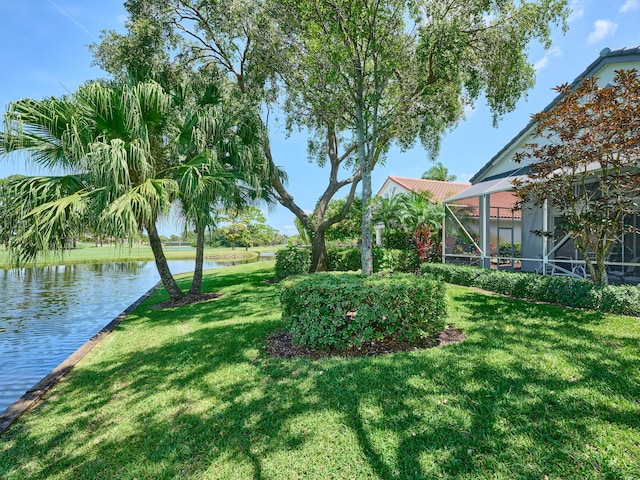 5455 S Fountains Dr S, Lake Worth, FL 33467 - view of grassy yard with a water view and a lanai
