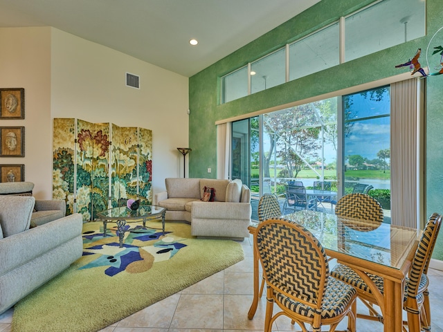 5455 S Fountains Dr S, Lake Worth, FL 33467 - living area with a high ceiling, light tile patterned floors, recessed lighting, and a water view